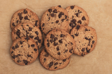 Homemade chocolate cookies on baking paper.