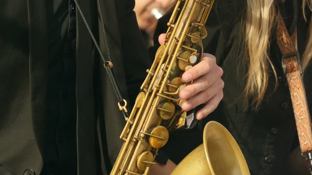 saxophone player of jazz band close to