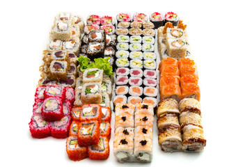 Big sushi and rolls set on white background