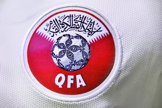 Moscow, Russia - July 14, 2018: The emblem of the Qatar Football Association QFA on the official athletic uniform of the Qatar football team. Association was founded in 1960. Illustrative editorial