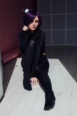 portrait of a beautiful girl cosplayer anime with purple hair