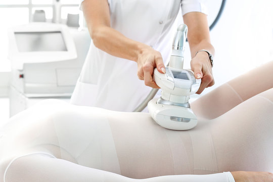 Vacuum massage. Endermology, abdominal vacuum massage. A woman's body during a care treatment