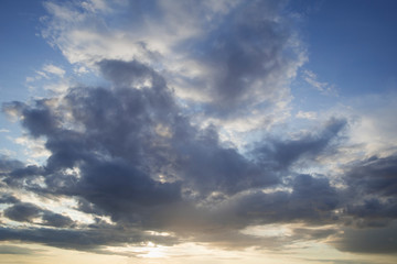 Naklejka na ściany i meble Amazing Sunset with grey clouds and blue sky