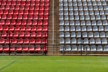 Empty red and grey seating at the Rand soccer football Stadium, Soweto, South Africa, for opposition, two competing teams