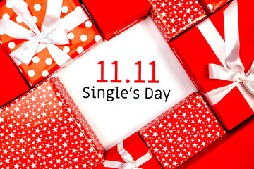 Online shopping of China, 11.11 single's day sale concept. The red gift boxes on white and brown...