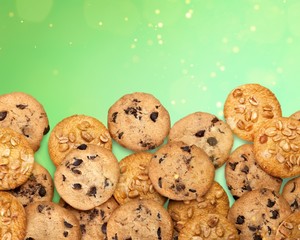 Cookies with sesame seeds and chocolate on white background