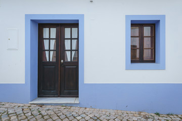 Wooden door and window with blue frame
