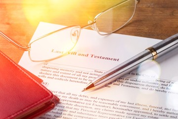 Glasses and pen with a Last Will and Testament