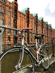 Fototapeta na wymiar Bike, Hamburg canal background, Old city view