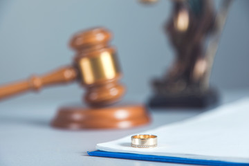 judge with justice lady and ring on desk