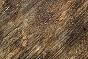 Fototapeta premium Wooden background texture. Brown scratched wooden cutting board.
