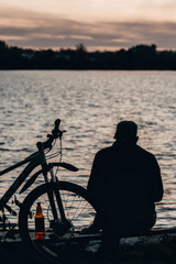 silhouette of cyclist at sunset