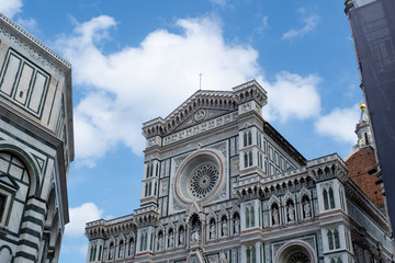 Florence's Santa Maria del Fiore, the Baptistery, blue sky and cloud.