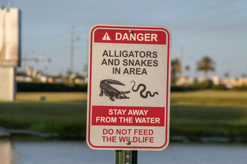 Orlando, USA, October 29, 2019: Warning Sign: Danger of Snakes and Alligators, Orlando, a complex...