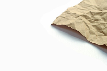 Fototapeta na wymiar Brown crumpled paper texture on white background.