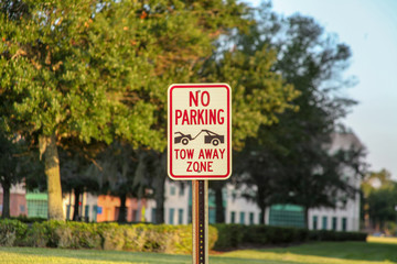 Orlando, USA, October 29, 2019: Warning Sign: Do Not Park, Towing Zone, a theme park complex, recreation and attractions, eating areas, is the second largest park in the country.
