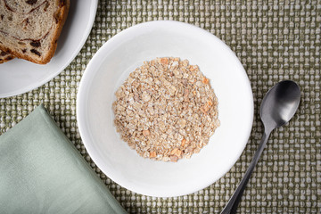 Dry oatmeal just poured in a bowl