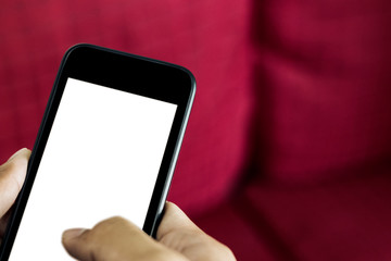 hand holding smart phone with blank screen.