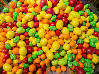 Close up of bowls filled with a large selection of different colored soft candies
