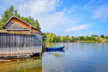 Fisherman wooden house with a boat in Ostashkov