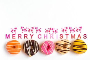 Donuts on white background wih christmas text, Celebration concept.