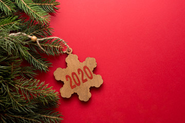 christmas red background with green tree and snowflake 2020, greeting new year card, copy space