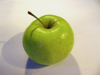 Green Apple on white background close-up.