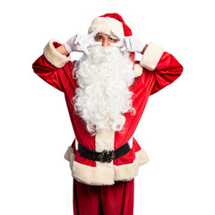 Middle age handsome man wearing Santa Claus costume and beard standing Doing peace symbol with fingers over face, smiling cheerful showing victory