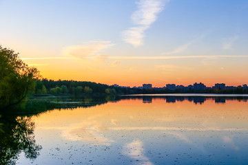 Fototapeta na wymiar Autumn. Autumn colors. Sunset on the lake. Kiev.