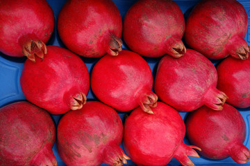 background of red ripe pomegranates