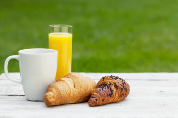 Coffee, orange juice and croissant