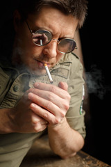 Portrait of man smoking cigarette