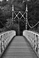 Howley suspension footbridge at victoria park passing over the river mersey. This bridge is around 100 years old and is hidden gem in warrington town, first ever taken this way. England  M
