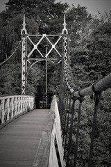 Howley suspension footbridge at victoria park passing over the river mersey. This bridge is around 100 years old and is hidden gem in warrington town, first ever taken this way. England  