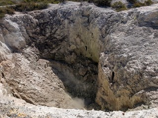 Hot smoke billowing out of a geo thermal valley