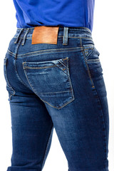 texture, blue men's jeans, men's ass covered with jeans close-up, back pocket jeans