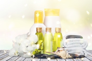 Bottles with organic essential aroma oils on background