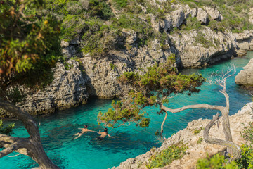Fototapeta na wymiar Swimming in Cala en Brut, Menorca