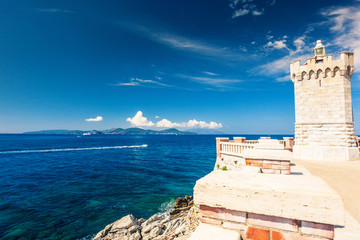 Lighthouse and view on island of Elba from piazza Bovio in Piombino