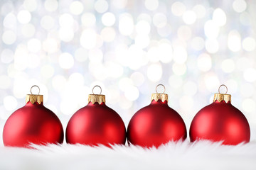 Christmas red baubles on blurred background