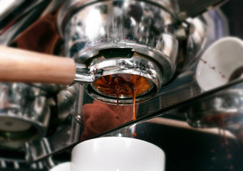 Making espresso coffee in coffeeshop or cafe closeup