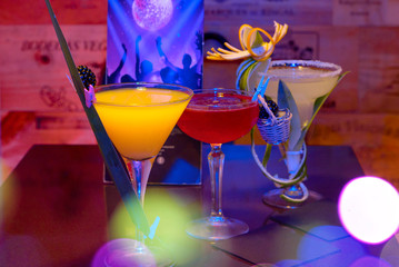 Cocktail glass with exotic drink in the pub bar. drinks concept