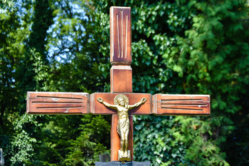 Cross and tombstone on an old cemetery.  
