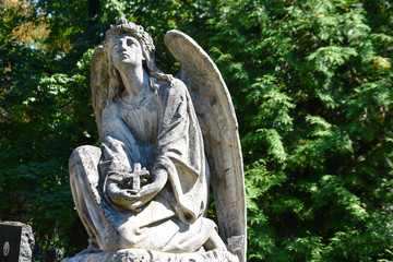 Angel statue in cemetery. Religious beliefs