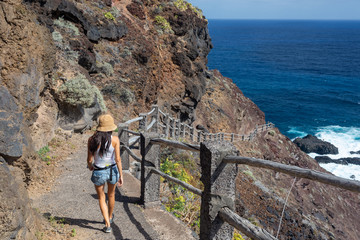 young active woman walks on the path