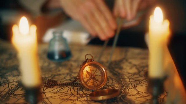 vintage 1850 explorer using a compass divider going over a map taking notes