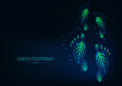 Futuristic glowing low polygonal green ecological footprints made of leaves on dark blue background.