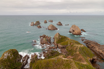 Nugget Point, New Zealand, showing the famous nuggets on a rather dull day.