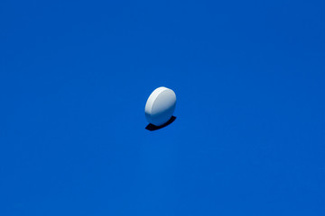Slide of white tablets on a light table.