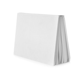 Open hardcover book with blank pages on white background